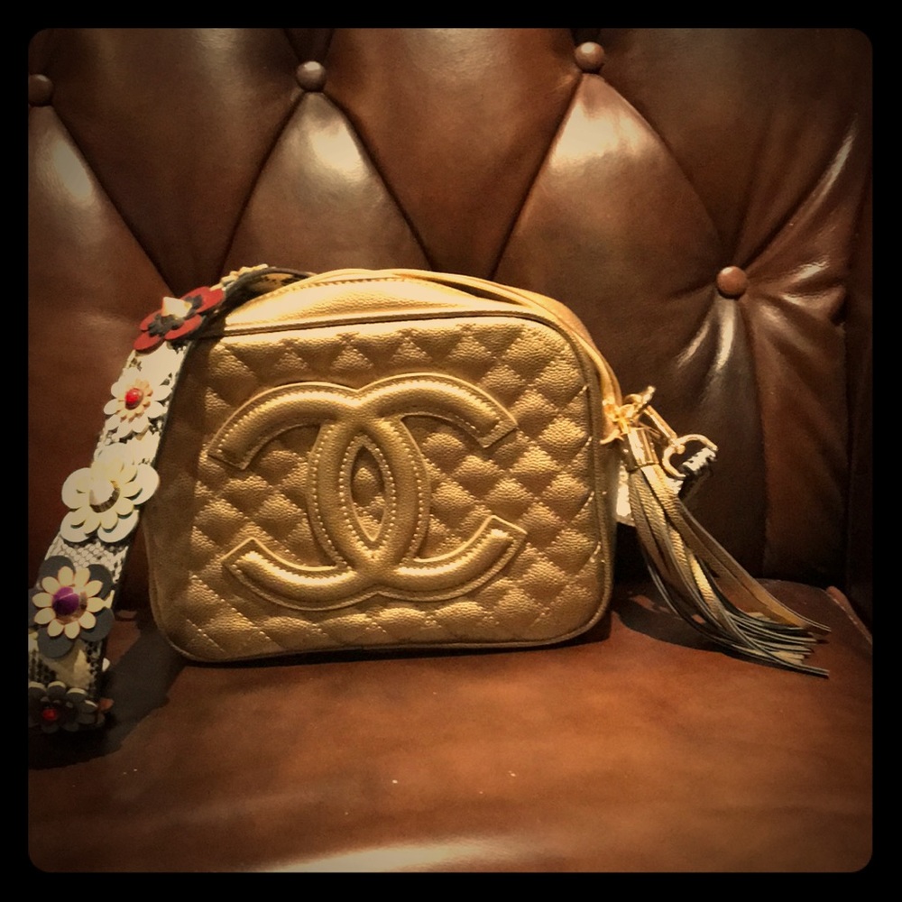 Gold purse with tassel and flowers strap